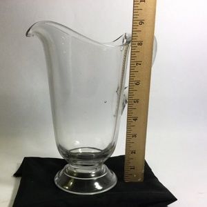 9" clear hand blown glass pitcher, includes air bubbles